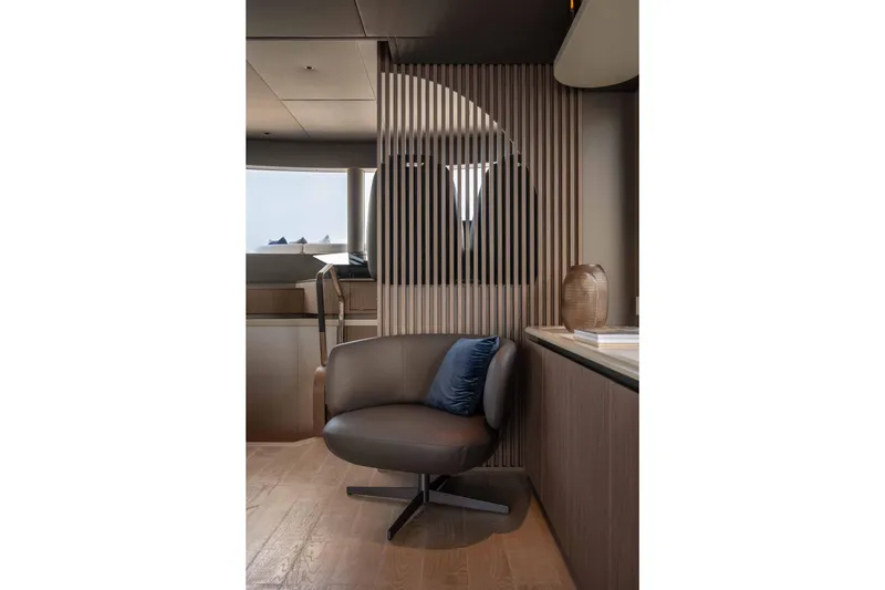 Slide: The Image of Luxurious interior of 2026 Absolute Navetta 58 yacht with modern chair and decor. - 31