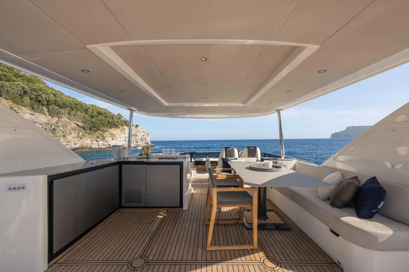 Slide: The Image of Luxurious 2026 Absolute Navetta 58 yacht deck with elegant seating and ocean view. - 25
