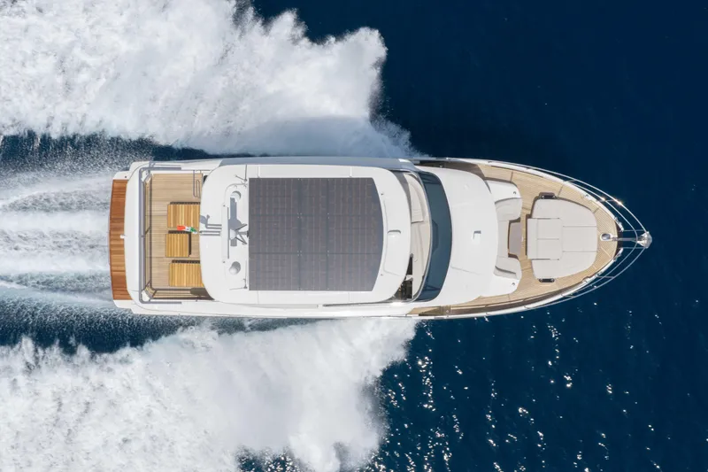 Slide: The Image of Aerial view of 2026 Absolute Navetta 58 yacht cruising on open water. - 23