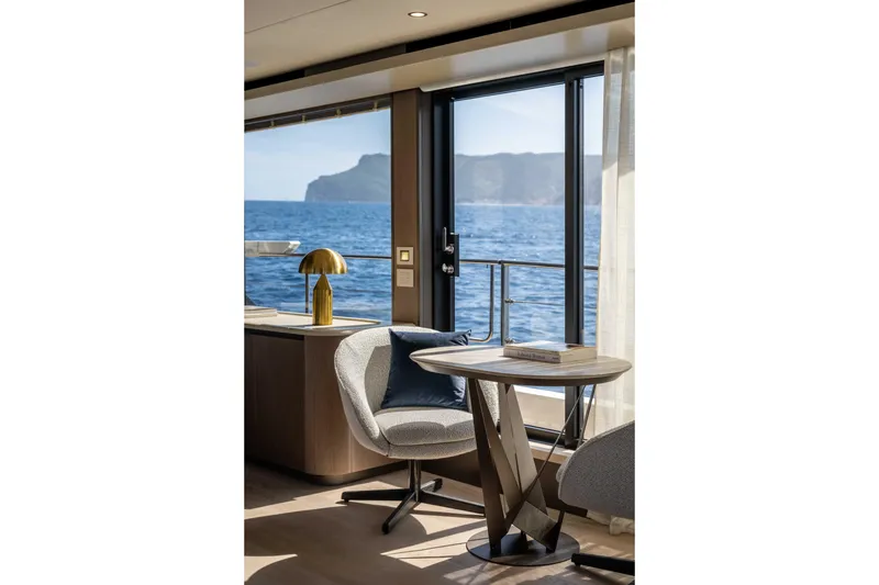Slide: The Image of Luxurious interior of 2026 Absolute Navetta 58 yacht with ocean view and modern decor. - 32