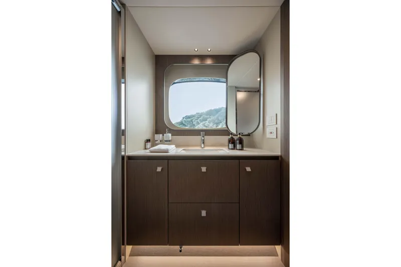 Slide: The Image of Luxurious bathroom interior of 2026 Absolute Navetta 58 yacht, featuring modern fixtures and scenic window view. - 48