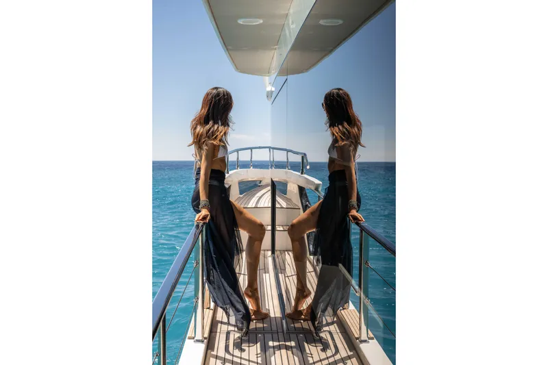 Slide: The Image of Woman enjoying ocean view on Absolute Navetta 58 yacht, 2026 model. - 13
