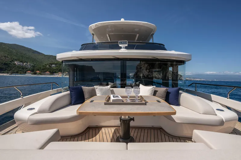 Slide: The Image of Luxurious 2026 Absolute Navetta 58 yacht with elegant outdoor seating and ocean view. - 18