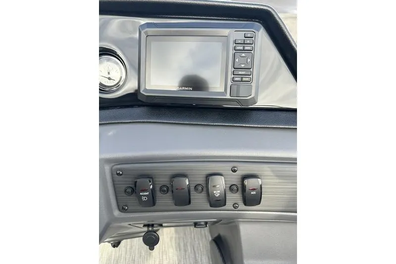 Slide: The Image of Dashboard of 2026 Bennington S 22 SSR with Garmin display and control switches. - 13
