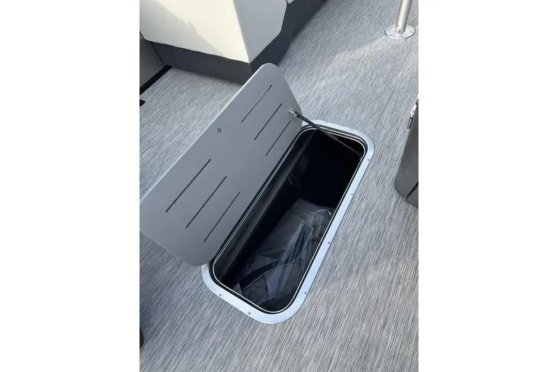 Slide: The Image of Open storage compartment on 2026 Bennington S 22 SSR boat deck. - 14