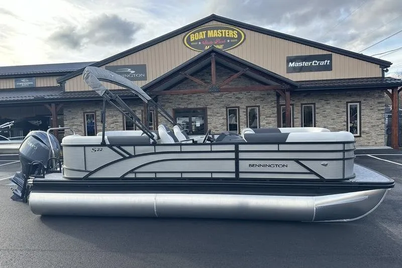 Slide: The Image of 2026 Bennington S 22 SSR pontoon boat parked outside Boat Masters Marine. - 2