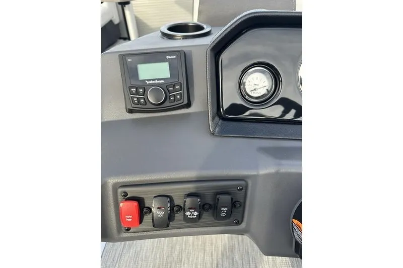 Slide: The Image of 2026 Bennington S 22 SSR dashboard with controls and gauges. - 9