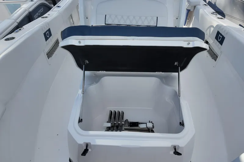 Slide: The Image of 2026 Sea Fox 268 Commander boat storage compartment with open lid, showcasing interior space. - 12