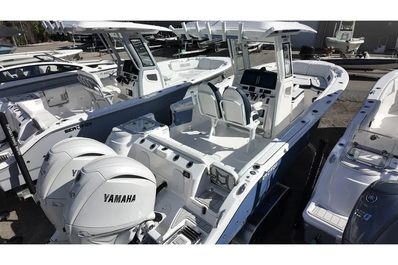 Slide: The Image of 2026 Sea Fox 268 Commander boat with dual Yamaha engines, docked and ready for adventure. - 3