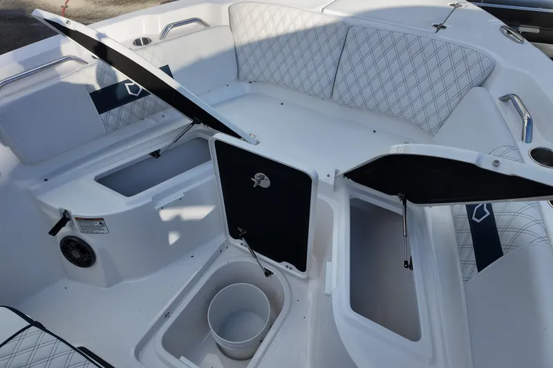 Slide: The Image of 2026 Sea Fox 268 Commander boat interior with open storage compartments and seating. - 8