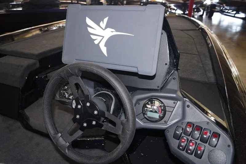 Slide: The Image of 2020 Skeeter ZXE20 boat dashboard with steering wheel and control panel. - 11