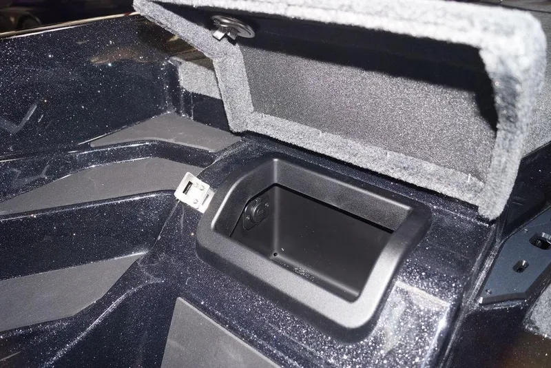 Slide: The Image of 2020 Skeeter ZXE20 boat storage compartment with open lid, showcasing interior details. - 14