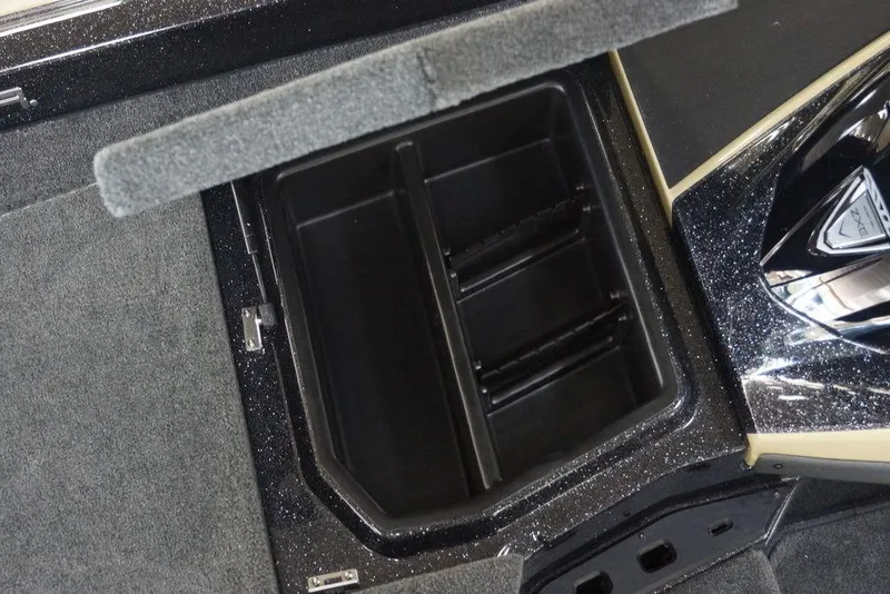 Slide: The Image of 2020 Skeeter ZXE20 boat storage compartment with open lid, showcasing interior design. - 21