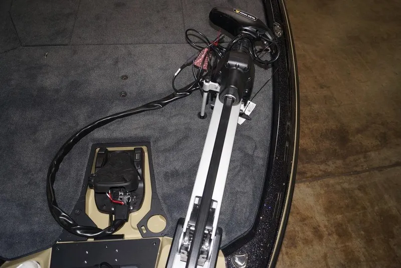 Slide: The Image of 2020 Skeeter ZXE20 boat with trolling motor and foot pedal on carpeted deck. - 24