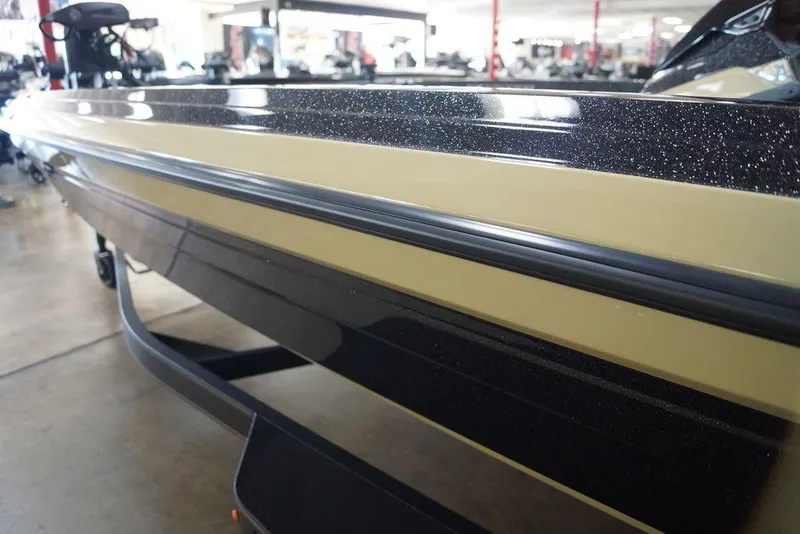 Slide: The Image of 2020 Skeeter ZXE20 boat in showroom, showcasing sleek design and glossy finish. - 28