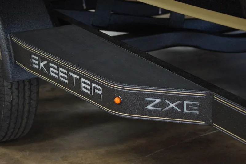 Slide: The Image of 2020 Skeeter ZXE20 trailer detail with logo and orange reflector. - 32