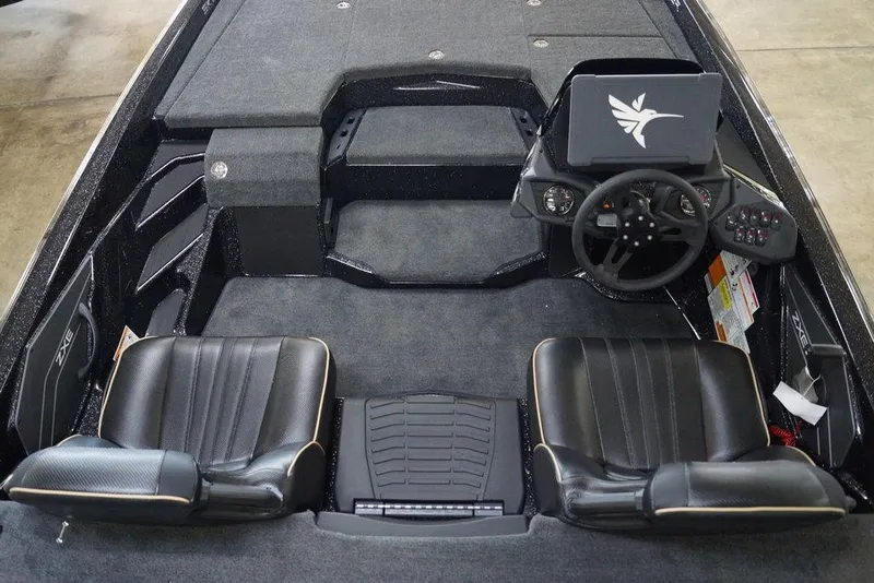 Slide: The Image of 2020 Skeeter ZXE20 boat interior with dual seats, steering wheel, and control panel. - 8