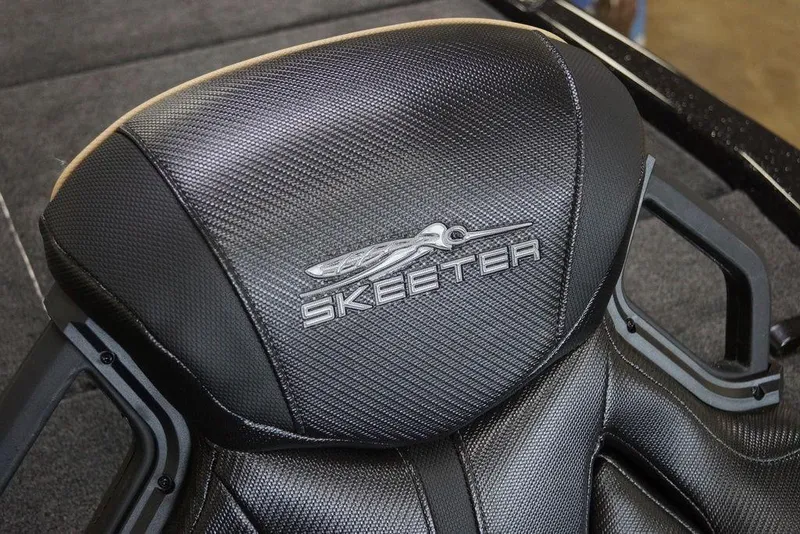 Slide: The Image of Skeeter ZXE20 2020 boat seat with textured black upholstery and logo. - 9