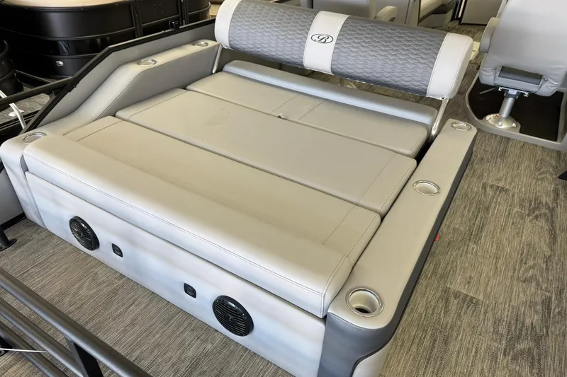 Slide: The Image of 2026 Bentley Pontoons Elite 253 Swingback with luxurious seating and integrated speakers. - 7