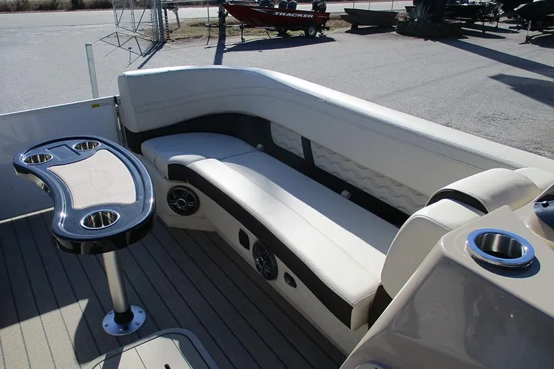 Slide: The Image of Luxurious seating area on 2026 SunCatcher Fusion 324RC pontoon boat with cup holders. - 10