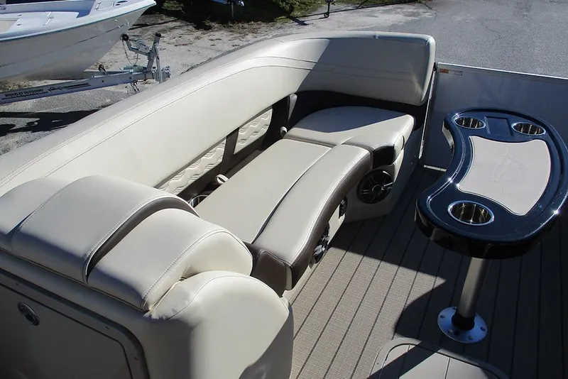 Slide: The Image of Luxurious seating and table on 2026 SunCatcher Fusion 324RC boat. - 14