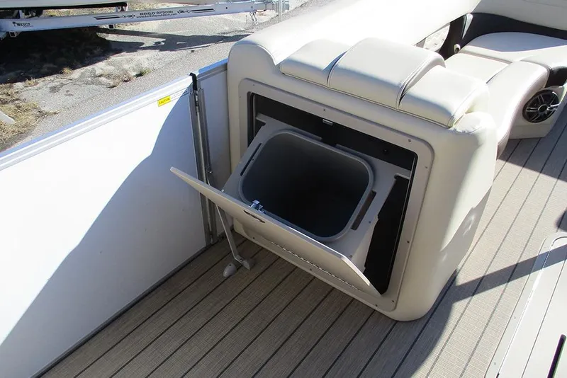 Slide: The Image of SunCatcher Fusion 324RC 2026 boat interior with open storage compartment. - 19