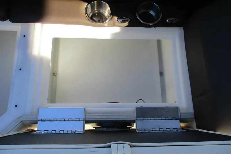 Slide: The Image of Interior storage compartment of 2026 SunCatcher Fusion 324RC boat with cup holders. - 24