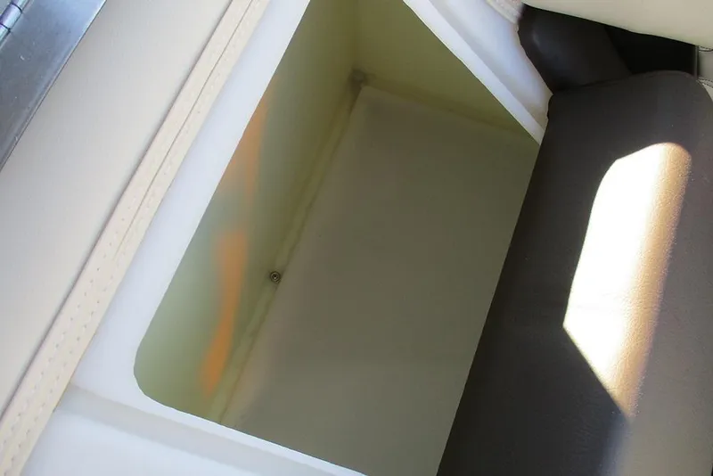 Slide: The Image of Open storage compartment in 2026 SunCatcher Fusion 324RC boat interior. - 29