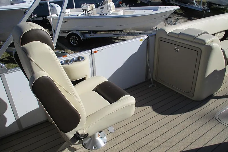 Slide: The Image of Luxurious seating on 2026 SunCatcher Fusion 324RC boat, featuring cup holders and storage. - 30