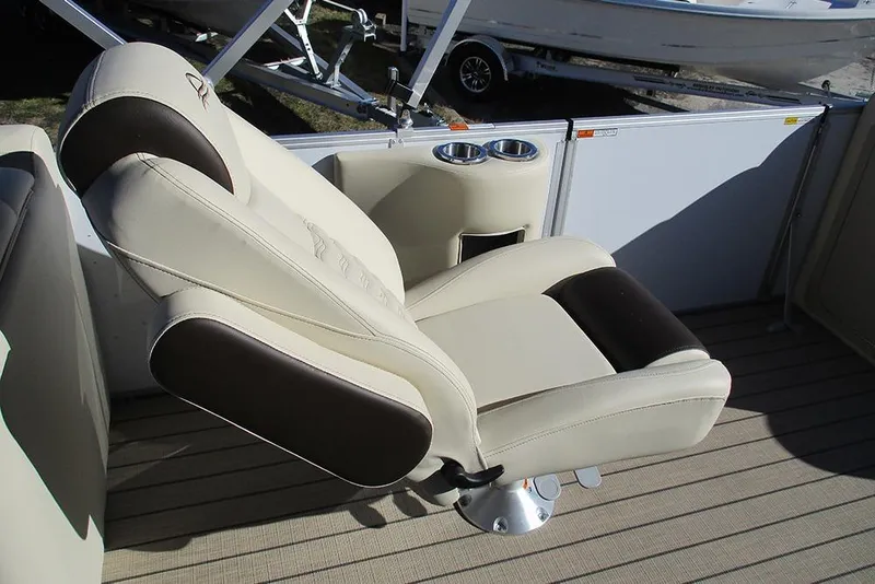 Slide: The Image of Luxurious seating on 2026 SunCatcher Fusion 324RC boat, featuring cup holders and premium upholstery. - 31
