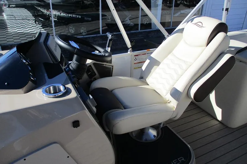 Slide: The Image of Captain's seat and helm of 2026 SunCatcher Fusion 324RC boat. - 32