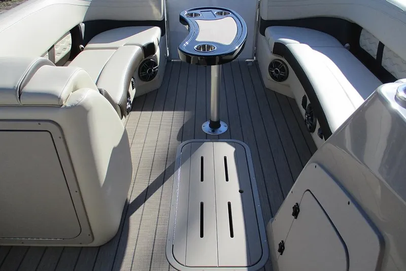Slide: The Image of Interior of 2026 SunCatcher Fusion 324RC boat with seating and table. - 34