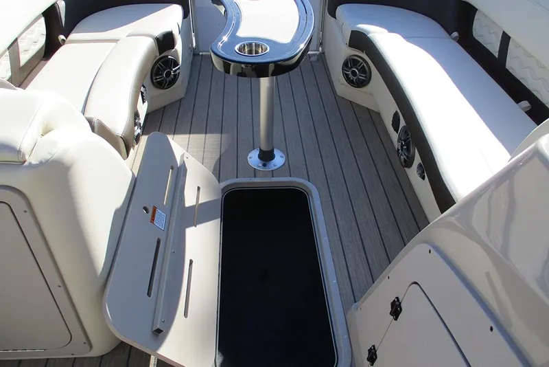 Slide: The Image of Luxurious interior of 2026 SunCatcher Fusion 324RC pontoon boat with seating and table. - 35