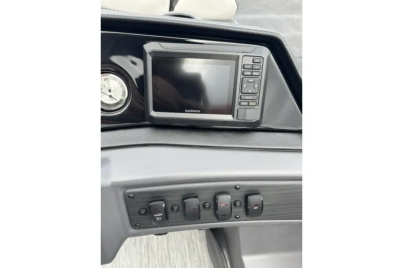 Slide: The Image of Dashboard of 2026 Bennington 20 S Quad Bench with Garmin display and control switches. - 10