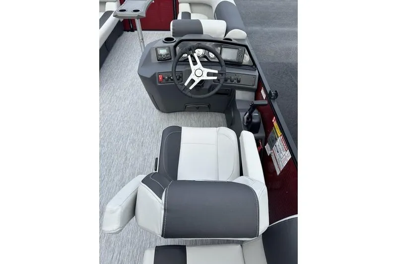 Slide: The Image of 2026 Bennington 20 S Quad Bench boat interior with steering wheel and seating. - 13