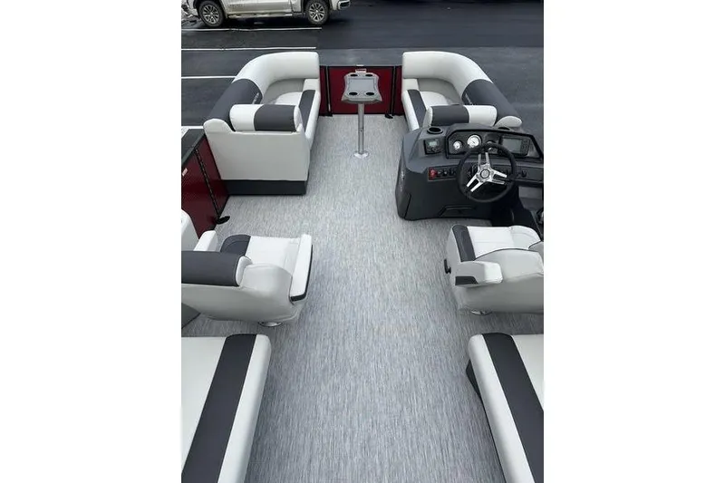 Slide: The Image of 2026 Bennington 20 S Quad Bench interior with plush seating and modern helm. - 15