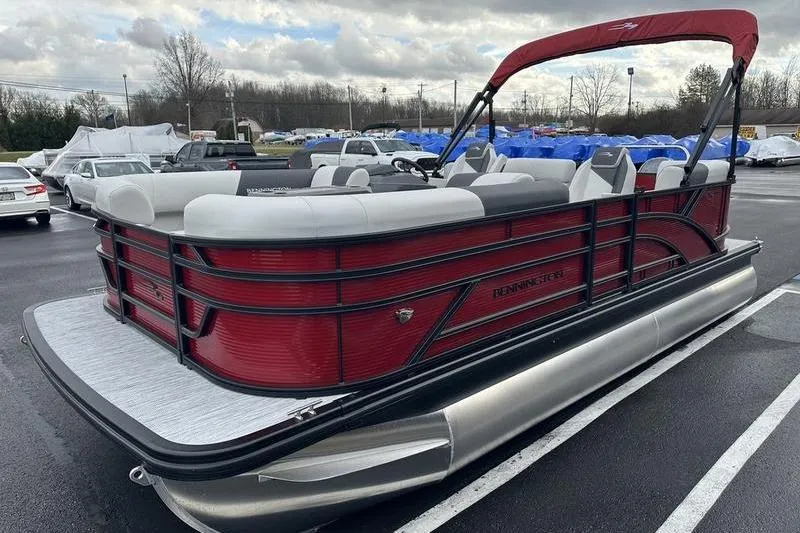 Slide: The Image of 2026 Bennington 20 S Quad Bench pontoon boat with red exterior in parking lot. - 4
