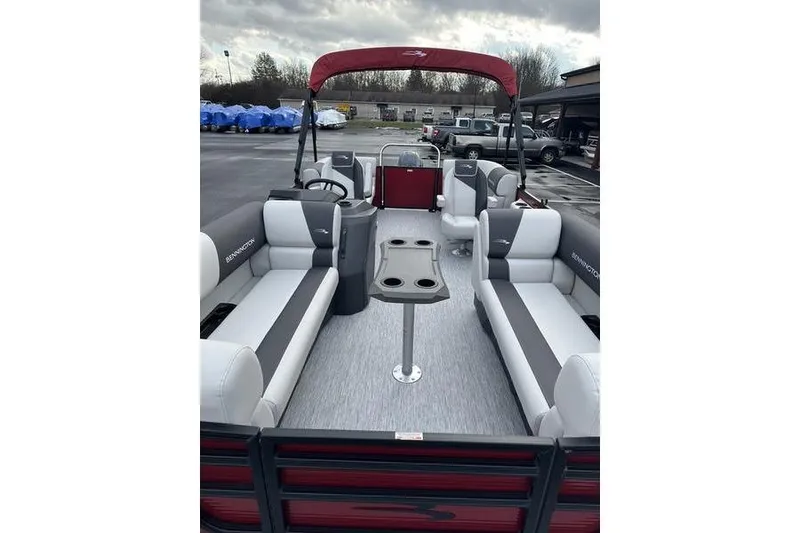 Slide: The Image of 2026 Bennington 20 S Quad Bench pontoon boat with spacious seating and modern design. - 5