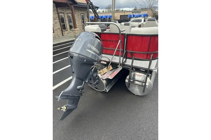 Slide: The Image of 2026 Bennington 20 S Quad Bench pontoon boat with Yamaha outboard motor. - 7