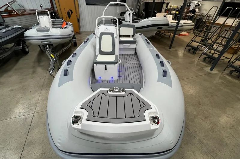 Slide: The Image of 2026 Highfield Classic 420 inflatable boat in showroom, featuring sleek design and modern seating. - 10
