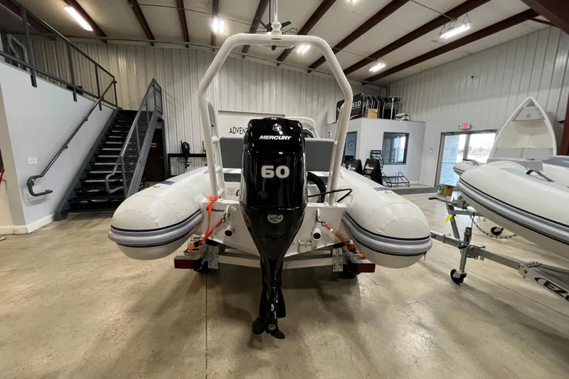 Slide: The Image of 2026 Highfield Classic 420 boat with Mercury 60 engine in showroom. - 11
