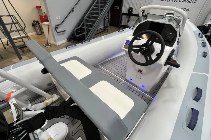 Slide: The Image of 2026 Highfield Classic 420 boat interior with steering console and seating. - 6