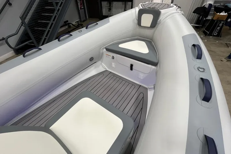 Slide: The Image of 2026 Highfield Classic 420 inflatable boat interior with cushioned seating and modern design. - 8