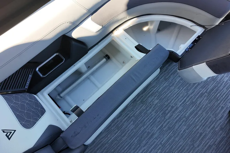 Slide: The Image of Open storage compartment in 2026 Viaggio Diamante D22U boat with gray seating and flooring. - 10