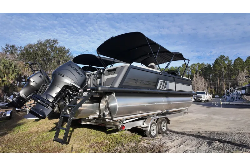 Slide: The Image of 2026 Viaggio Diamante D22U pontoon boat with Suzuki engines on a trailer. - 4