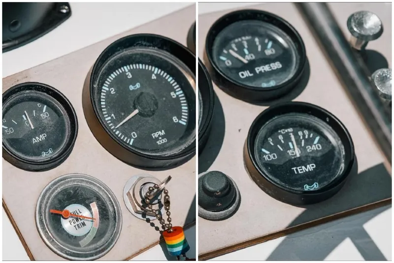 Slide: The Image of Dashboard gauges of a 1976 Aquasport 24 Launch boat, showing RPM, oil pressure, and temperature. - 26
