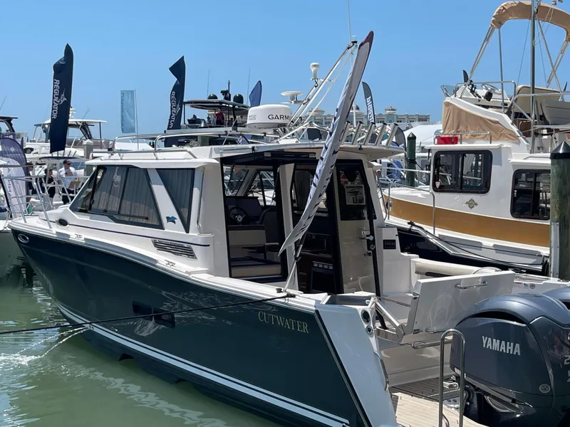 The Image of 2023 Cutwater C-288 boat docked at a marina, featuring Yamaha outboard engines. - 0