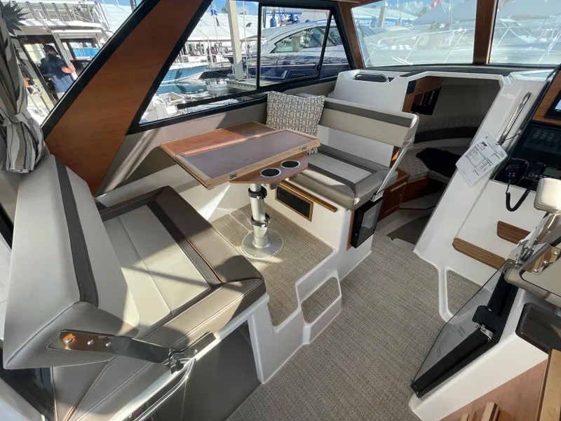 Slide: The Image of Interior of 2023 Cutwater C-288 boat with seating and table setup. - 26
