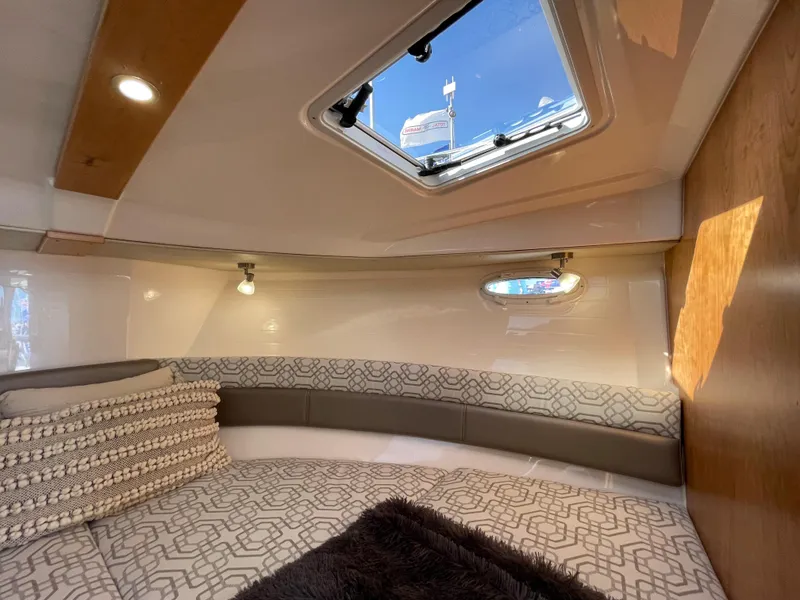 Slide: The Image of 2023 Cutwater C-288 cabin interior with skylight and modern bedding. - 46