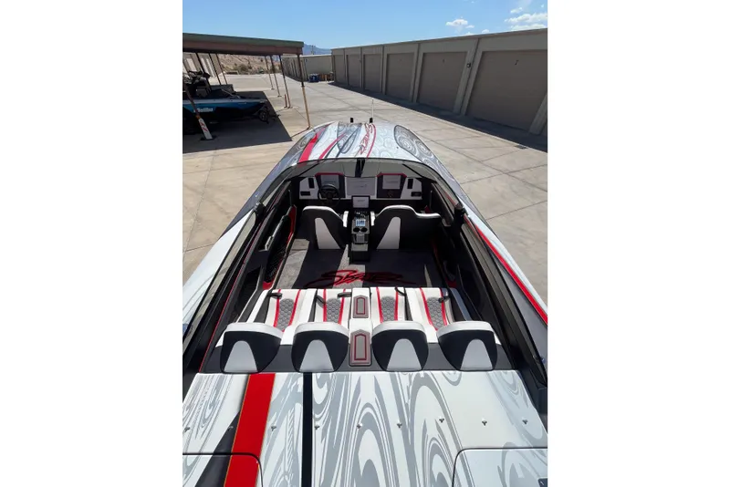 Slide: The Image of 2009 Skater 388 boat interior with sleek design and red accents. - 12